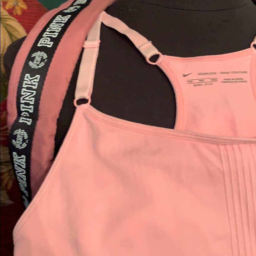 Pink back pack with large logo on bottom. - Picture 4 of 8